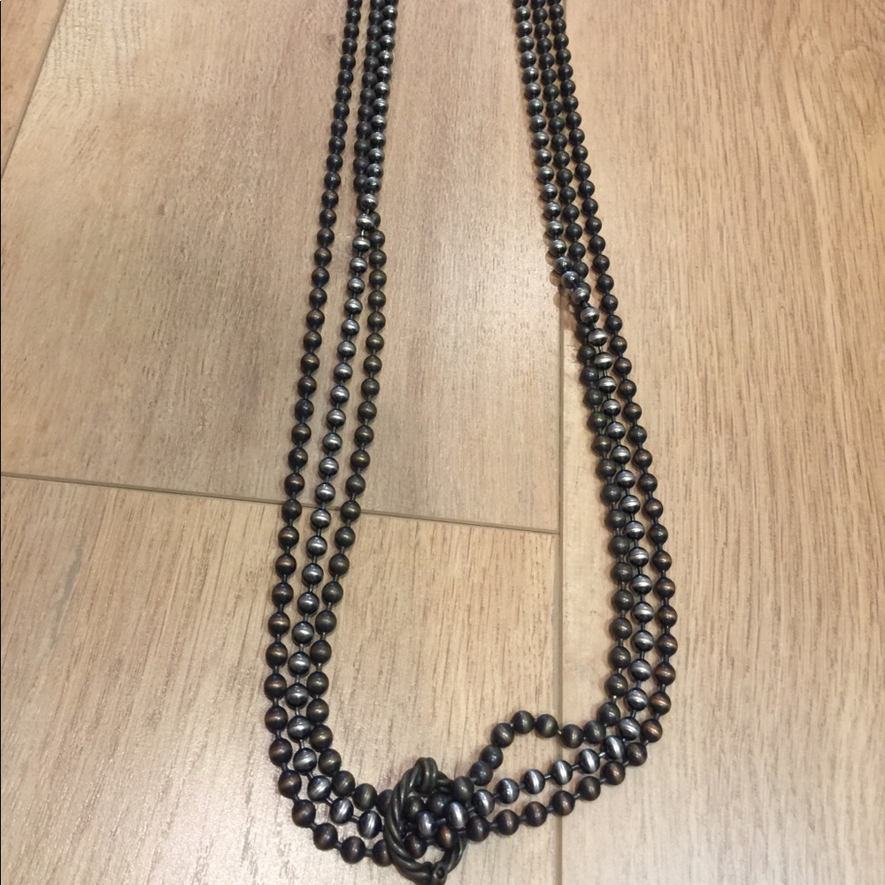 Triple strand necklace with fastener